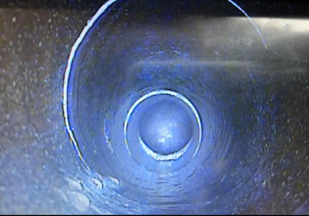 CCTV camera view inside a drain pipe showing clear pipe condition